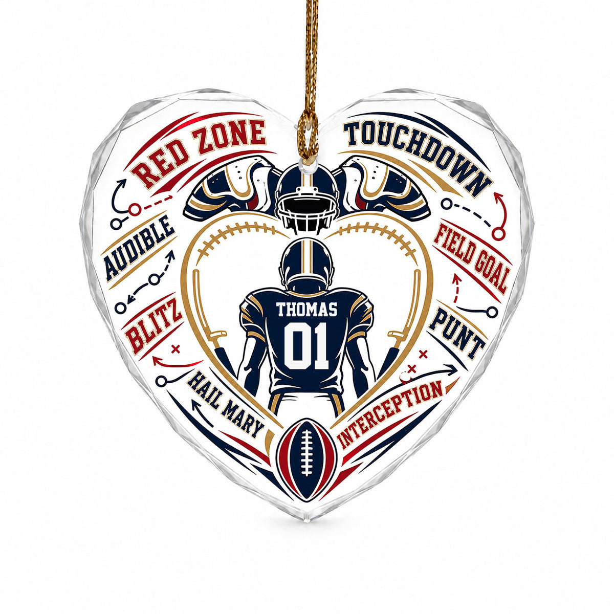 Heart-shaped glass ornament with back-view football player, gold stitched heart frame, football, and play diagram elemen