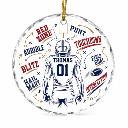 Round faceted glass ornament with football player back view, goalpost, football, and play diagrams in navy, dark red, an