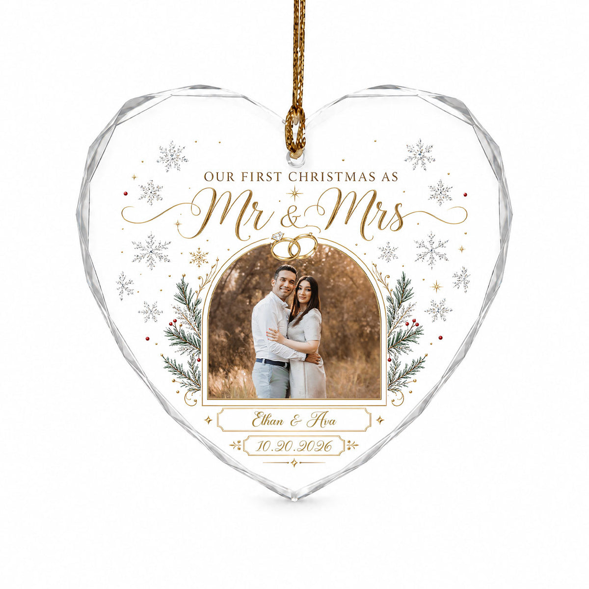 Heart-shaped glass ornament with photo, gold wedding rings, pine branches, snowflakes, and Mr & Mrs text.
