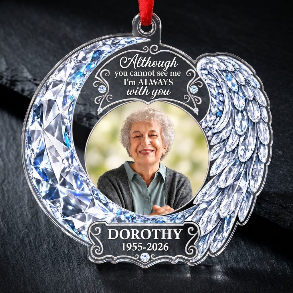 Acrylic ornament with blue crystal-look crescent moon, angel wing, circular photo frame and memorial quote.