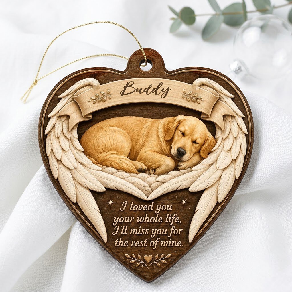 Heart-shaped wood ornament with a sleeping golden retriever, angel wings, ribbon banner, stars, and a memorial quote.