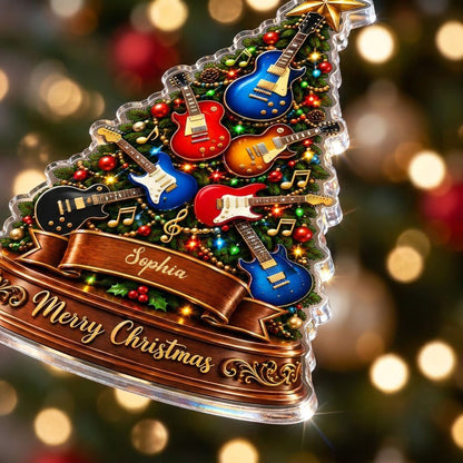 Green tree-shaped acrylic ornament with electric guitars, gold music notes, a name banner, and a gold star topper.