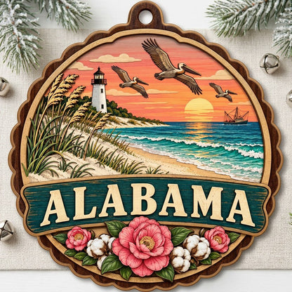 Scalloped wood ornament of an Alabama coastal scene with lighthouse, pelicans, camellias, cotton, and teal banner