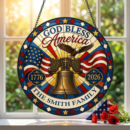 Round stained-glass style suncatcher with Liberty Bell, eagle, flags, 'GOD BLESS America' 1776–2026 and a family name