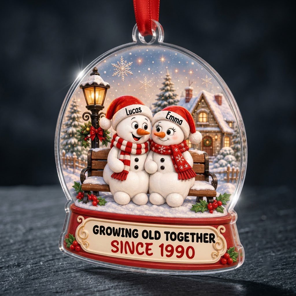 Acrylic snowglobe ornament with two snowmen on a bench, Santa hats, and Growing Old Together text.