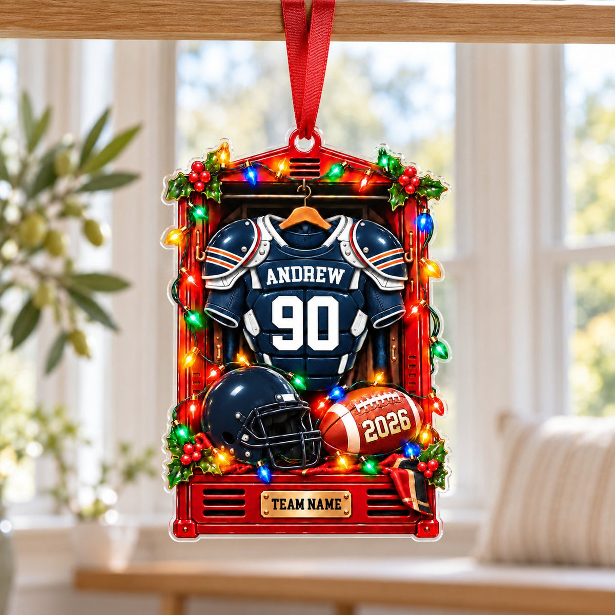 A red sports locker ornament with a football jersey, helmet, ball, holly, and Christmas lights on a custom-cut acrylic s
