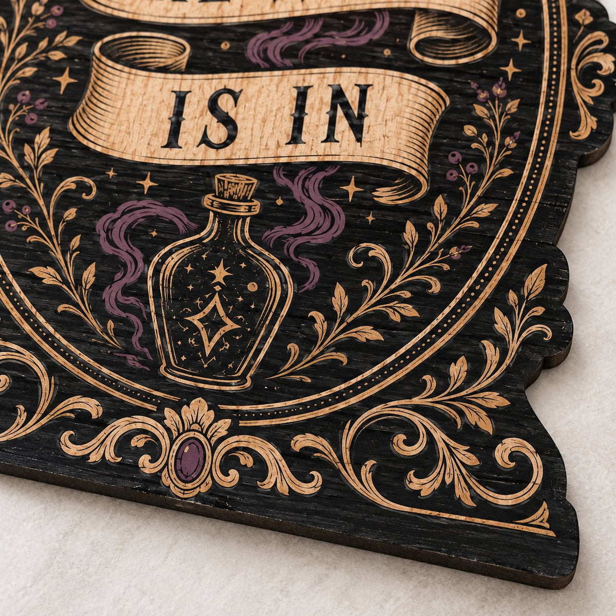 Gothic plaque sign reading "THE WITCH IS IN" with crescent moon, stars, purple smoke, potion bottle and ornate filigree 