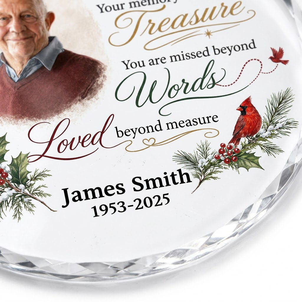 Round glass ornament with memorial quote, four red cardinals, pine and holly greenery, and a center photo portrait.