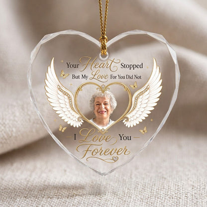 Heart-shaped glass ornament with white angel wings, gold heart photo frame, golden butterflies and sparkles.