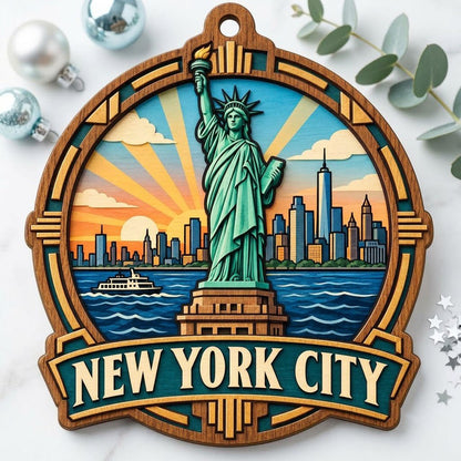 Wood ornament with Statue of Liberty, NYC skyline, ferry and sunrays in an Art Deco frame reading NEW YORK CITY.