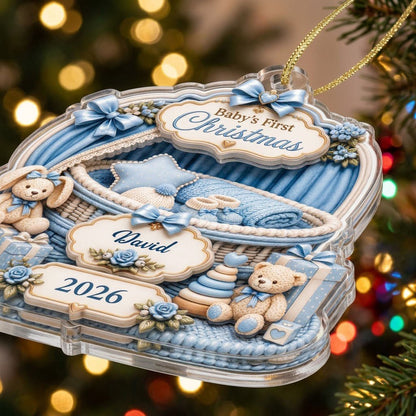 Clear acrylic ornament with blue nursery bassinet, bunny, teddy, and Baby's First Christmas with name and year.