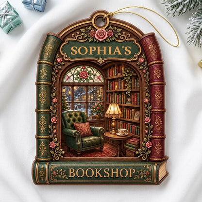 Arch-shaped wood ornament framed by book spines with BOOKSHOP and a cozy library scene with lamp and armchair.