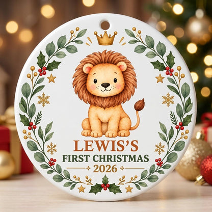 Round ceramic ornament with a cute crowned lion inside a festive wreath of green leaves, red berries, stars and snowflak