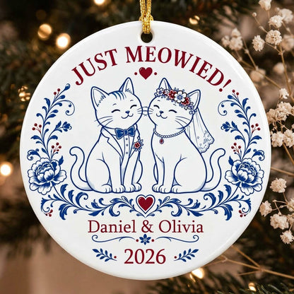 Round ceramic ornament with two wedding cats, 'JUST MEOWIED!', names and year with blue and red folk floral accents