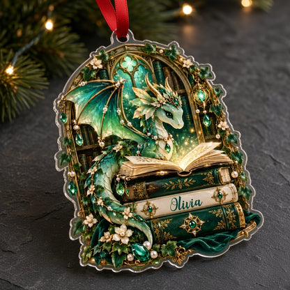Emerald green dragon with gold-accented wings on vintage books, name Olivia, stained-glass arch acrylic ornament.
