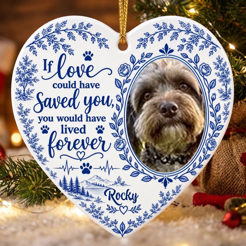 White heart ceramic ornament with blue dog photo frame wreath, memorial quote, paw heartbeat, and a mountain lake scene.