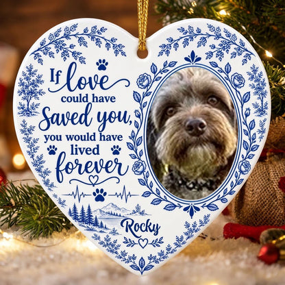 White heart ceramic ornament with blue dog photo frame wreath, memorial quote, paw heartbeat, and a mountain lake scene.