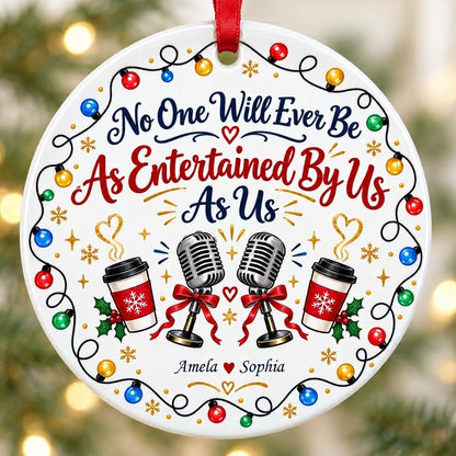 Round ceramic ornament with lights border, two microphones with red bows, and two coffee cups with heart steam.