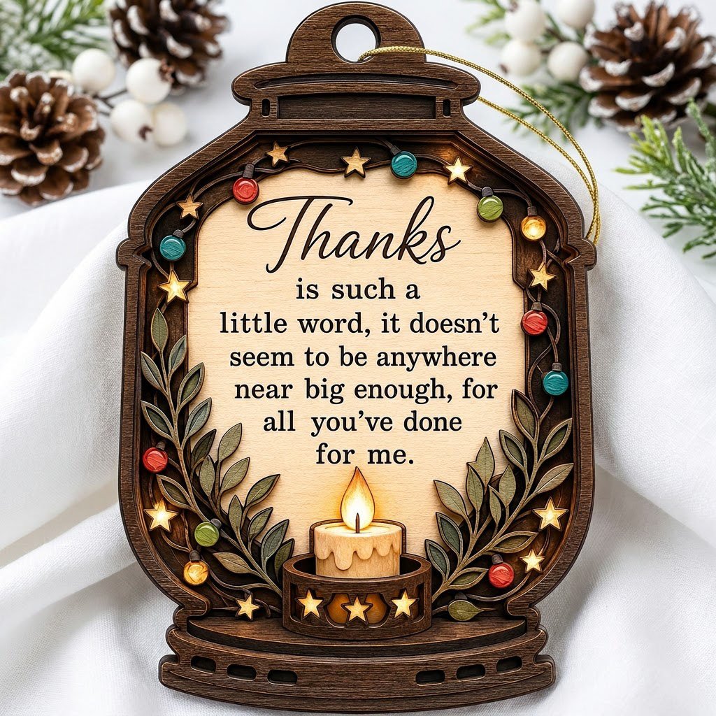 Lantern-shaped wood ornament with candle, colorful fairy lights, leafy branches, and a thank-you quote.
