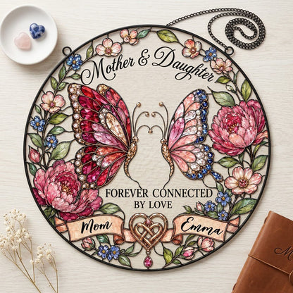 Round stained-glass style suncatcher with two butterflies, pink peonies and a ribbon banner for Mother & Daughter.