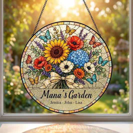 Round stained-glass style suncatcher with floral bouquet, butterflies, and 'Mana's Garden' with names.