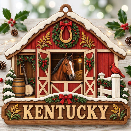 Snow-topped red barn ornament with brown horse, horseshoe wreath, wheat, and “KENTUCKY” text on a barn silhouette.