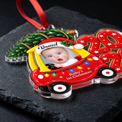 Acrylic ornament shaped like a toy car with tree, Baby's 1st Christmas text, lights, and a baby photo.