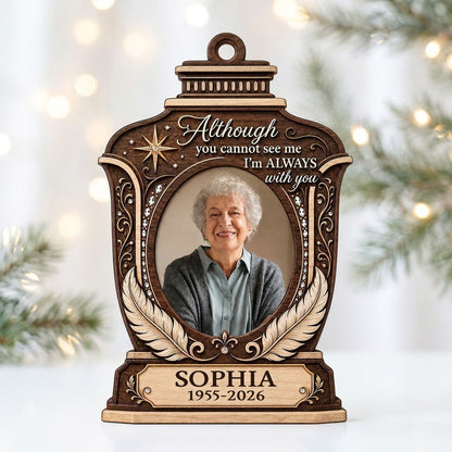 Lantern-shaped memorial wood ornament with oval photo, two feathers, starburst, fleur-de-lis and scrollwork accents.
