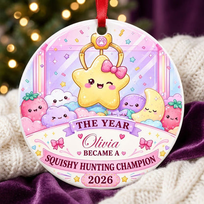 Round ceramic ornament with a claw machine and winking star, personalized with a name and year in pastel colors.
