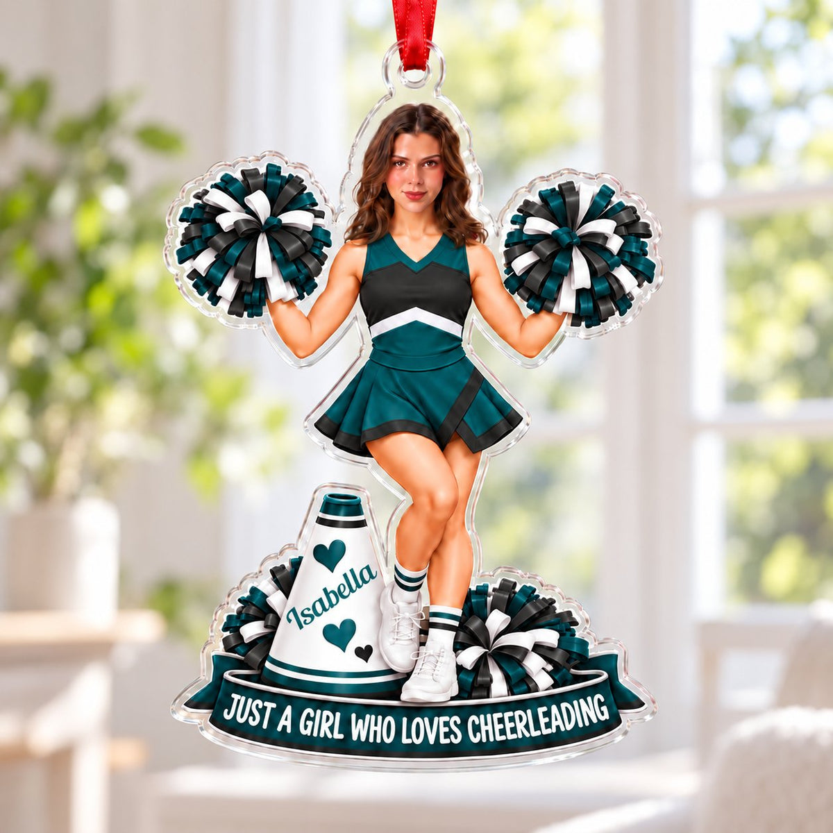 Custom-cut acrylic ornament with a cheerleader photo, teal and black pom-poms, megaphone, and a teal name banner.