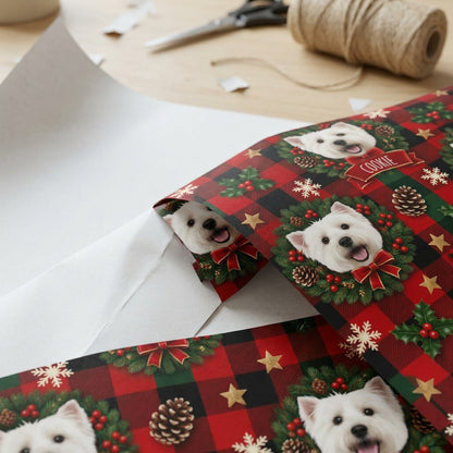 Red and green plaid wrapping paper with Westie in wreaths, snowflakes, stars, holly, and a name on red banners.