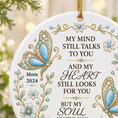 White round ornament with jeweled butterflies, floral wreath, and memorial quote with personalized name and year.