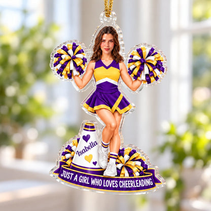 Custom-cut acrylic ornament of a cheerleader with pom-poms, megaphone, photo face, name banner and red ribbon.