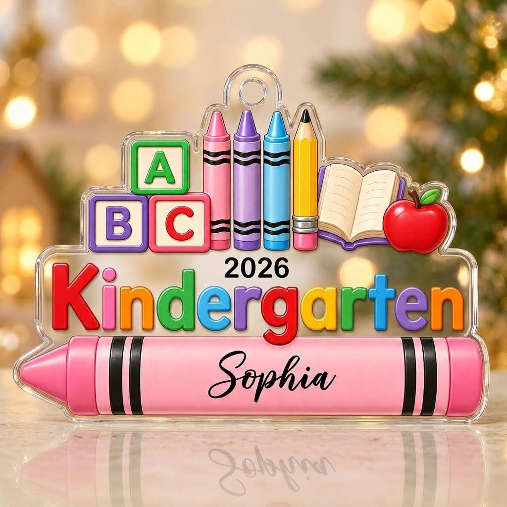 Clear acrylic ornament with ABC blocks, crayons, apple, open book and 'Kindergarten 2026' with a pink name banner