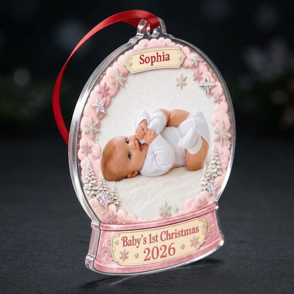 Pink snow globe acrylic ornament with "Baby's 1st Christmas", name banner, year base, and baby photo frame