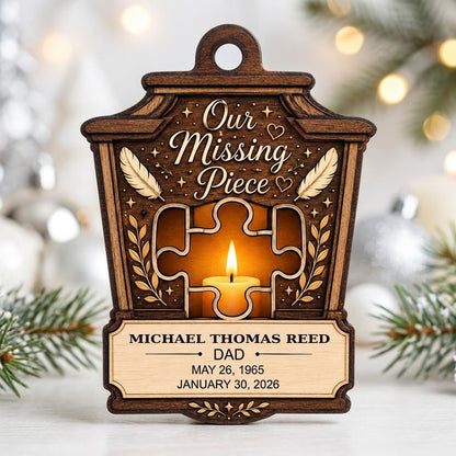 Wood ornament with lantern-style frame, puzzle-piece cutout revealing candle glow, “Our Missing Piece” text and feather 
