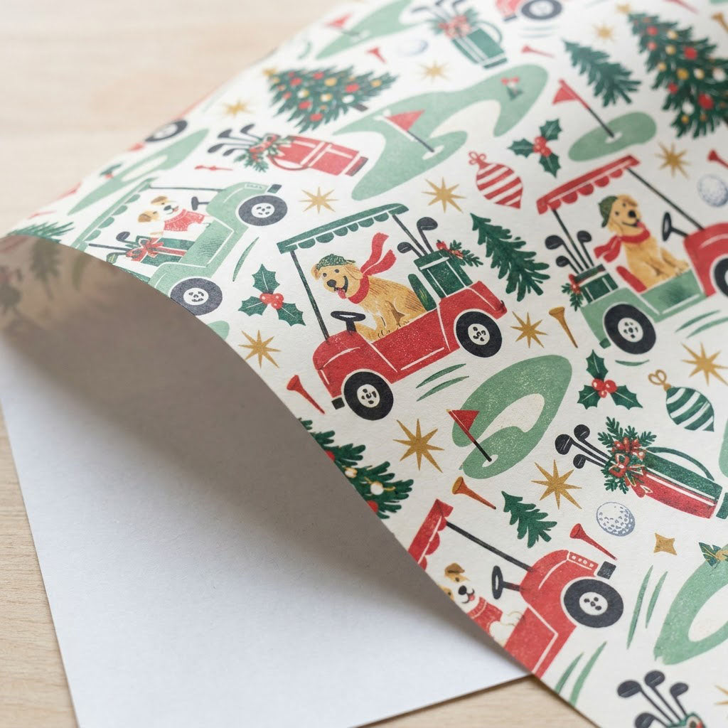 Cream wrapping paper with golden retrievers driving red and green golf carts among Christmas trees and golf icons.