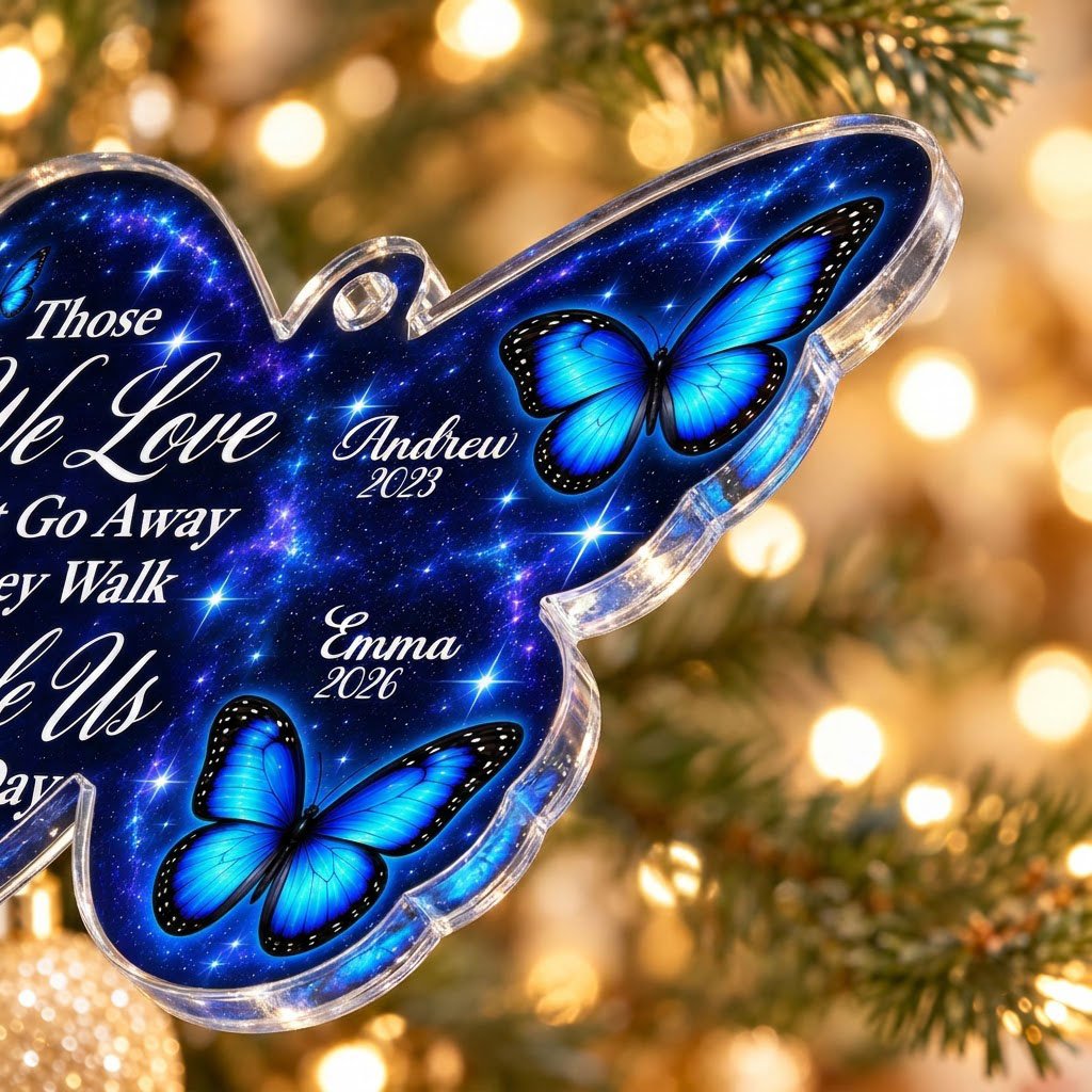 Butterfly-shaped ornament with blue butterflies and a galaxy background, reading Those We Love Don't Go Away.