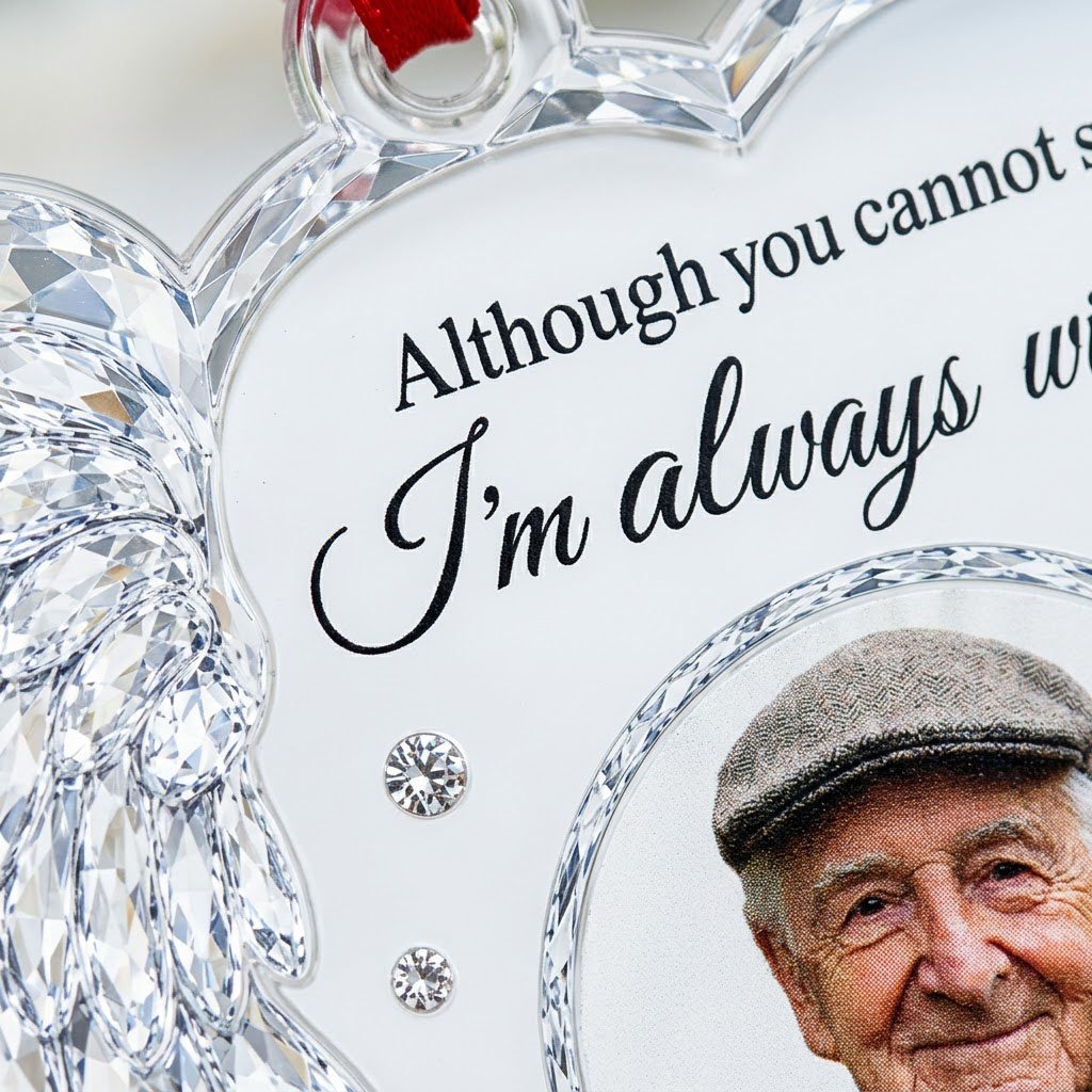 Clear acrylic heart ornament with crystal wing on the left, diamond accents, and a central circular photo frame.