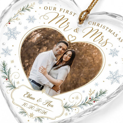 Heart-shaped glass ornament with couple photo, 'Our First Christmas As Mr & Mrs', pine sprigs, berries and gold snowflak