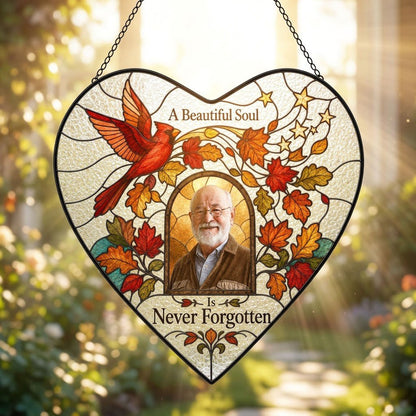 Heart stained glass suncatcher with flying red cardinal, autumn leaves, gold stars, and a central photo frame.