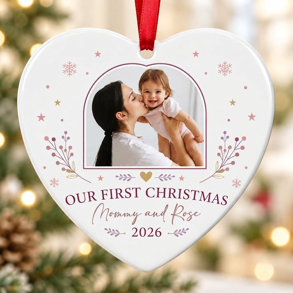 Heart ceramic ornament with “OUR FIRST CHRISTMAS”, arch photo frame, stars, snowflakes, berry sprigs, leafy flourishes, 