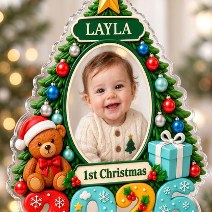 Green Christmas tree acrylic ornament with star topper, baby photo frame, teddy bear, and 2026 numbers.