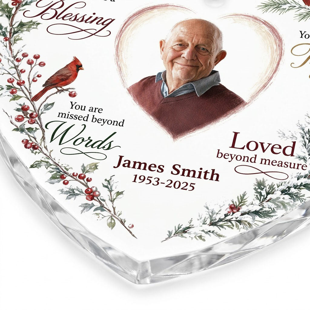 Heart glass ornament with a photo, red cardinals, and a winter wreath of pine, holly, berries, and pinecones.