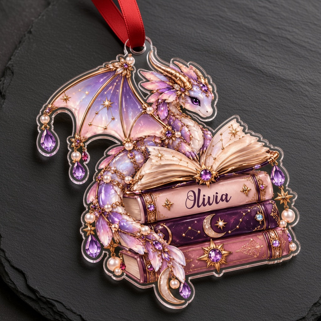 Pastel purple and gold dragon on an open book atop stacked books with jewels and pearls on a clear acrylic ornament.