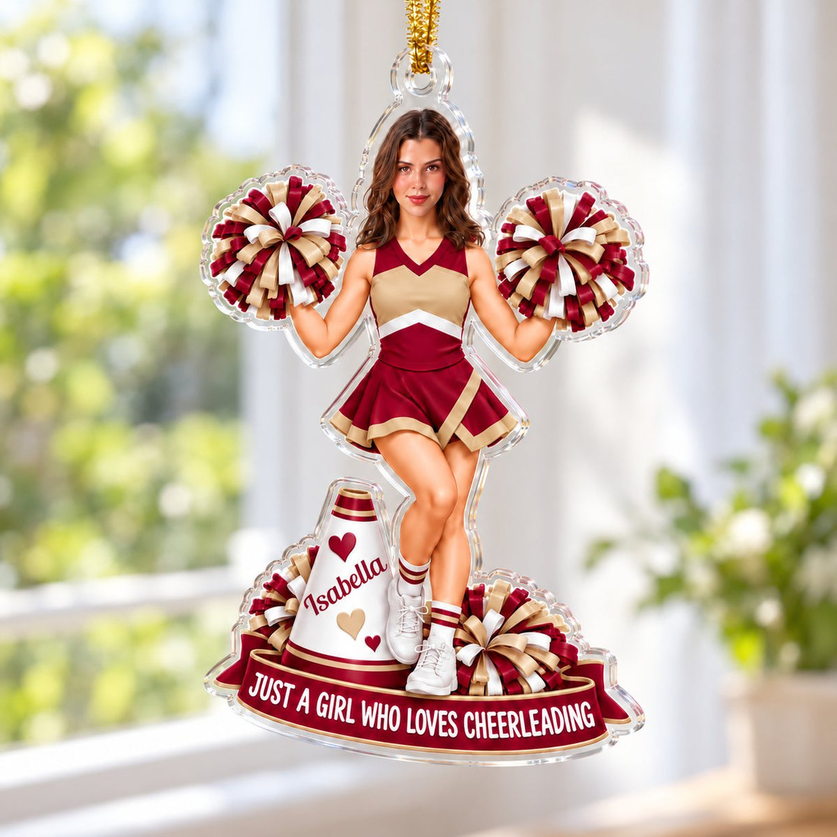 Custom-cut acrylic ornament of a maroon-and-gold cheerleader with pom-poms, megaphone, and a name banner.