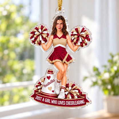 Custom-cut acrylic ornament of a maroon-and-gold cheerleader with pom-poms, megaphone, and a name banner.