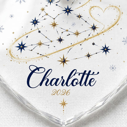 Heart-shaped stained glass suncatcher with a starry Christmas tree, gold ribbon heart, and snowflakes.