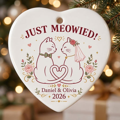 Two white cats with bow tie and bridal veil under JUST MEOWIED with roses and stars on a heart ceramic ornament.