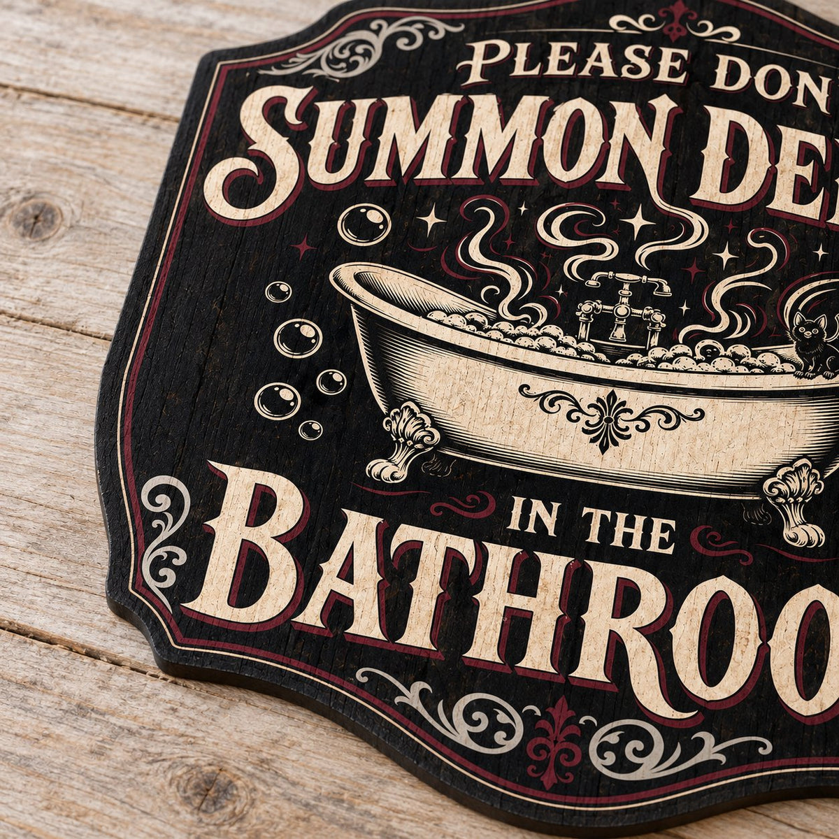 Ornate plaque with tub, bat-winged black cat, bubbles, stars, and 'Please Don't Summon Demons in the Bathroom'.